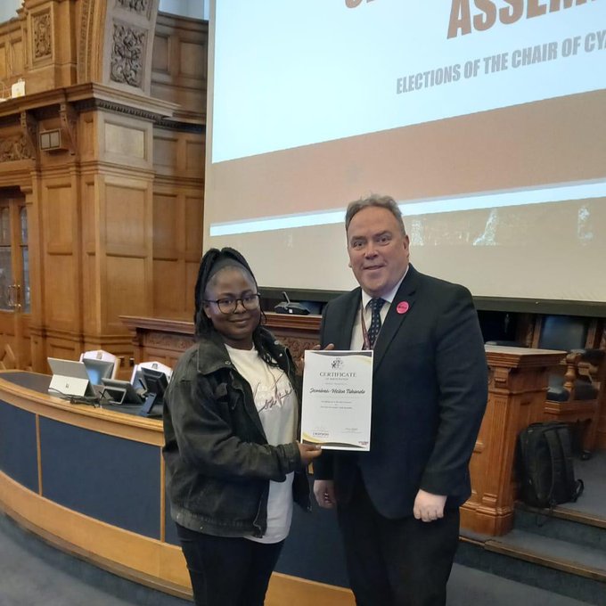 The new Chair of Croydon Youth Assembly, Jemima Tshondo, receiving her certificate from Jason Perry, Croydon's Executive Mayor